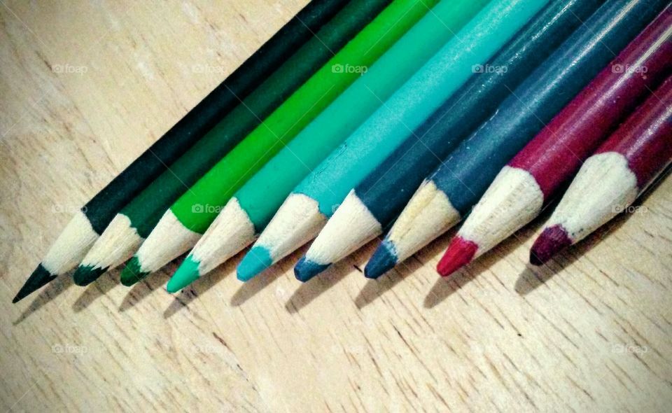 Colored pencils in a row