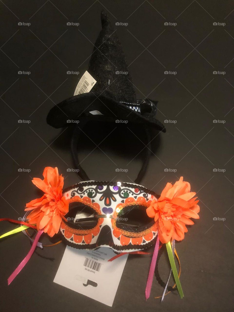Halloween party costumes - a colorful carnival mask and a witch hat headband 