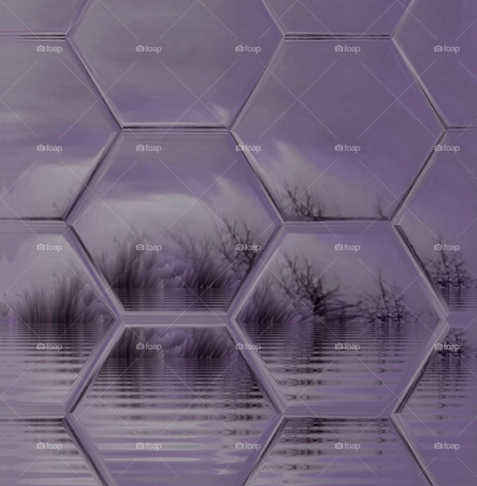 silhouette of trees reflecting on the water against purple sky as see through leaded glass window