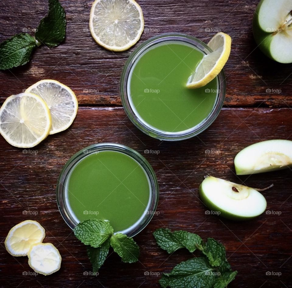Fresh pressed green juice with lemon and mint
