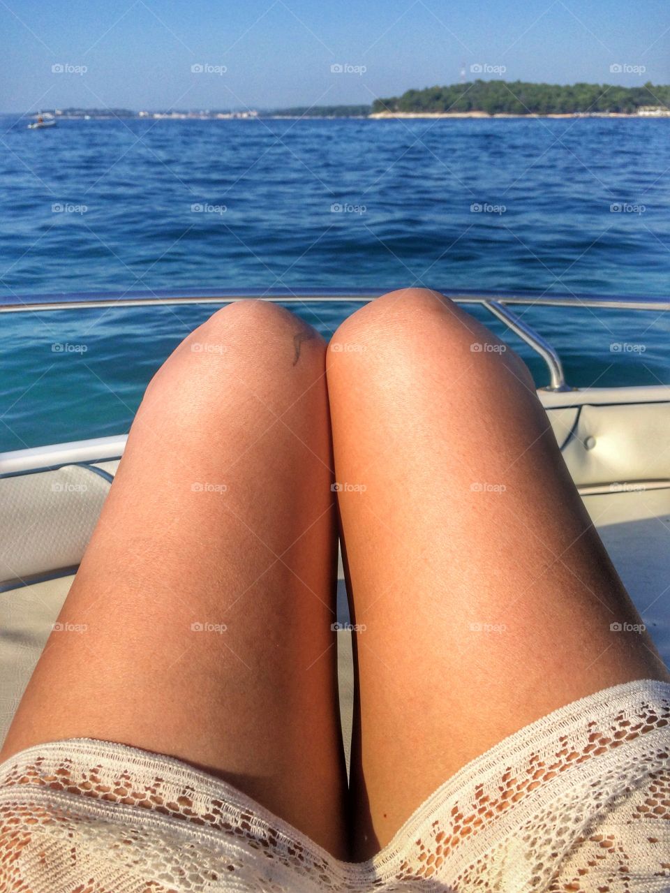 Legs of woman and sea