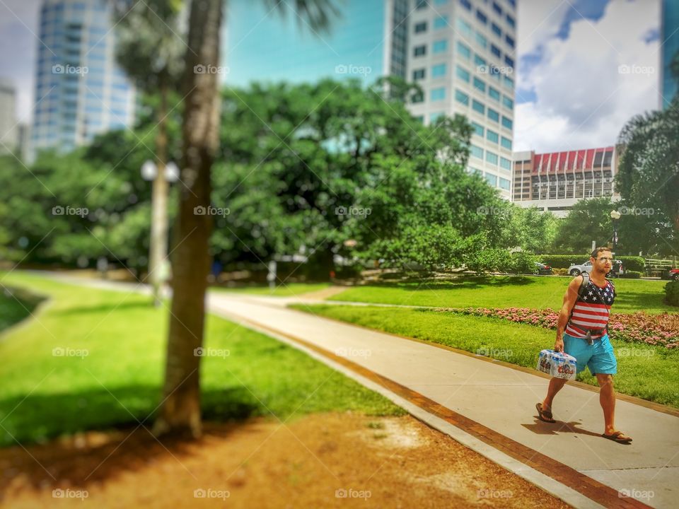 All American. Man carrying beer 