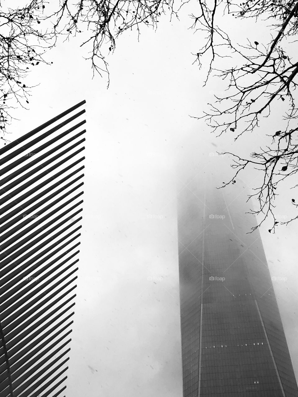 Oculus building with Freedom Tower in snowstorm