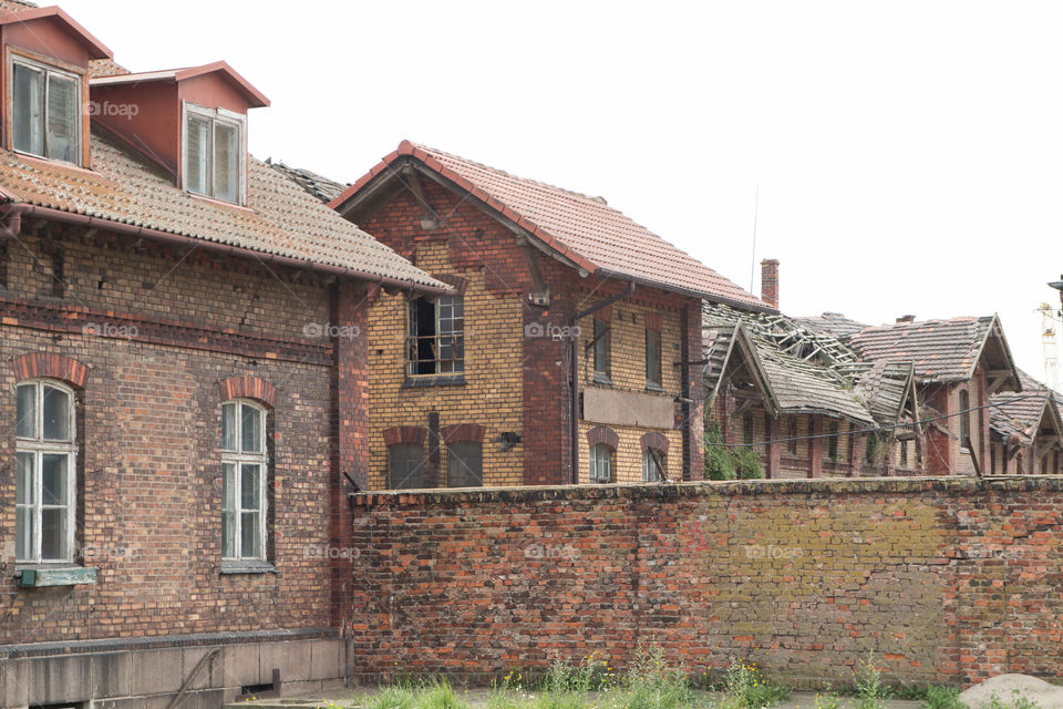 Damaged retro shipyard buildings.