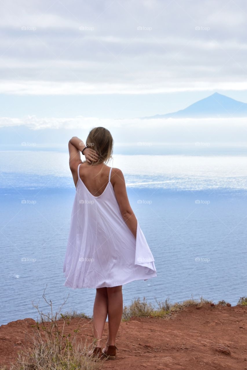 woman on view point on la gomera canary island in Spain- tenerife island view