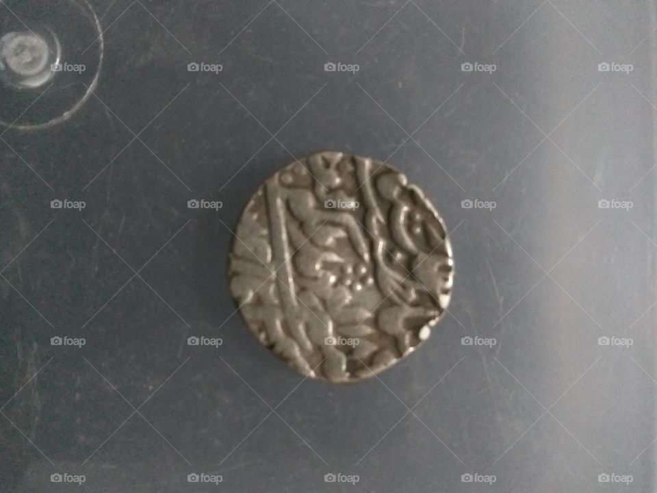 antique silver coin. Akbar brought about a change in the shape of his coins. He issued gold, silver and copper coins in round, square, rectangular and mihrabi shapes. He was the only Mughal emperor who issued 26 types (varieties) of gold coins. Some popular gold coins to name are—Emperor. Rahas. Atmah. Binsat, Jugul, Lalejalali, Aftabi, llahi, Lale Jalahi. Adalgutka, Maherabi. Muini, Gird, Dhan, Salimi. Man, Samni, Kala. Rabi The Shahenshah gold coin weighed 102 tolas Most of these were commemorative coins His name was struck on Shahrukhi silver coins either with and without titles on the reverse, which read as Jalaluddin Muha