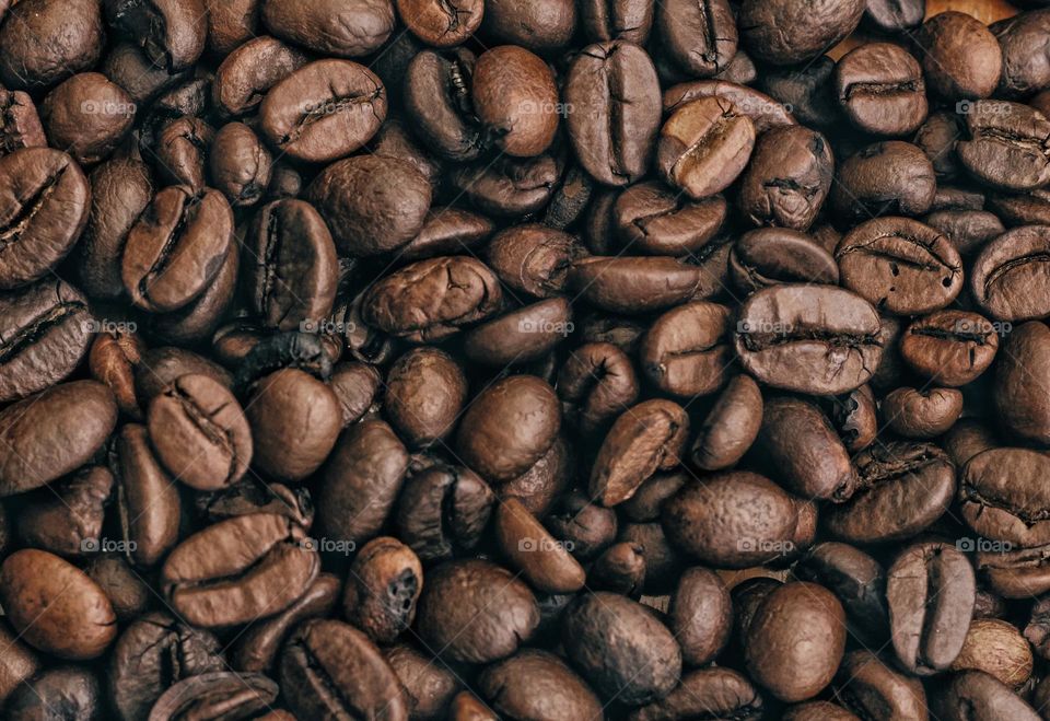 a collection of all coffee beans in one container that will be processed into coffee