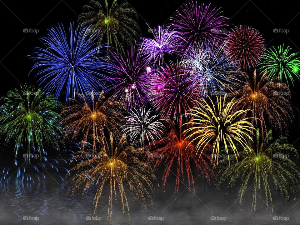 Fireworks exploding in rainbow colors.