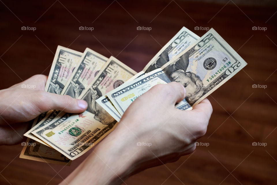 dollars in hands