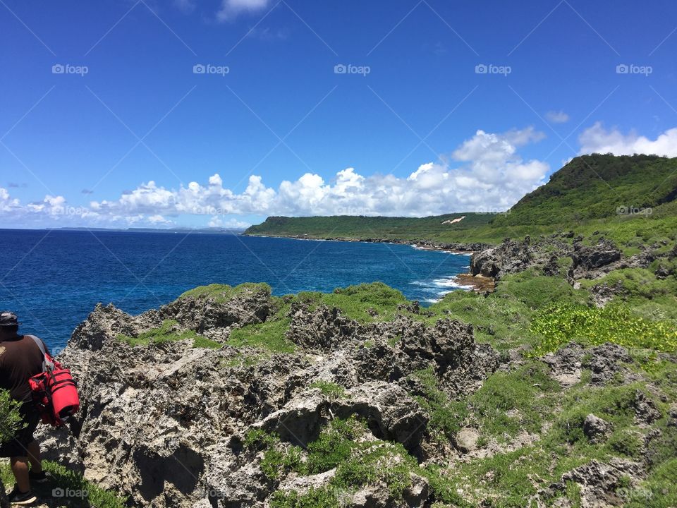 Look out located near Pagat caves on Guam this view shows the ocean and cliffs leading down to it.