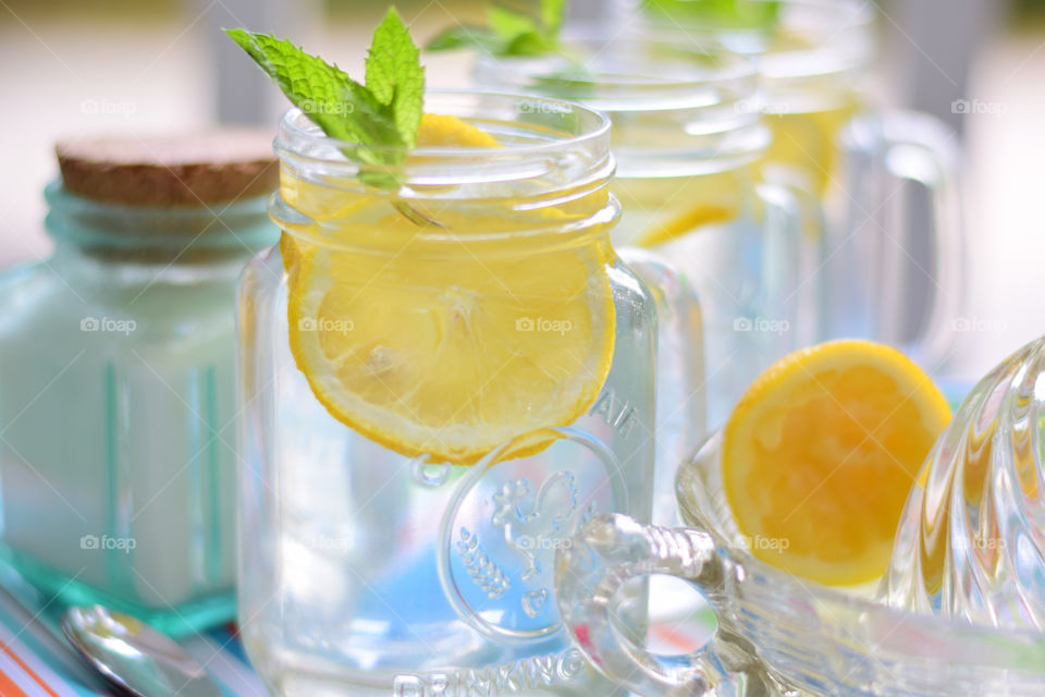 Juicing fresh lemons for homemade lemonade