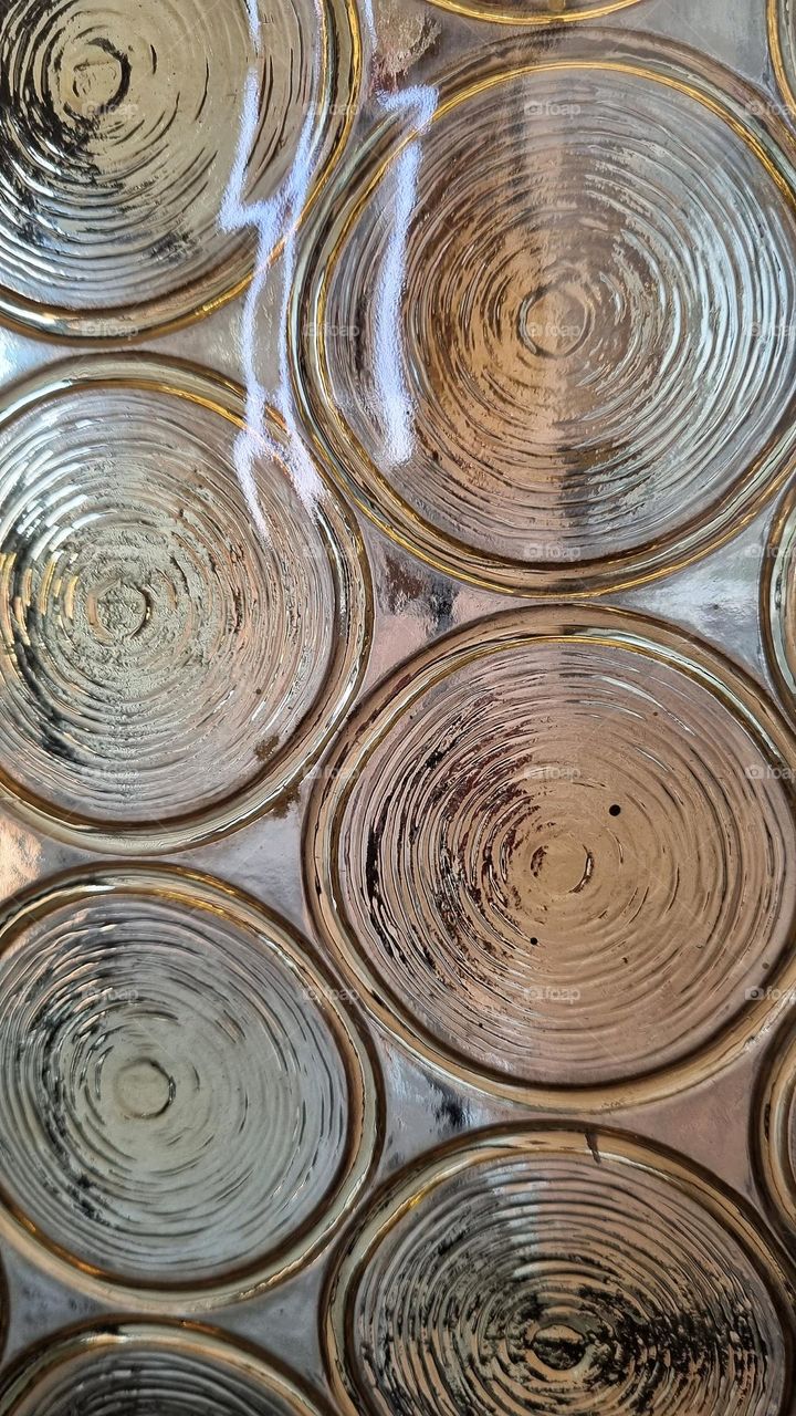 circles in a glass door.