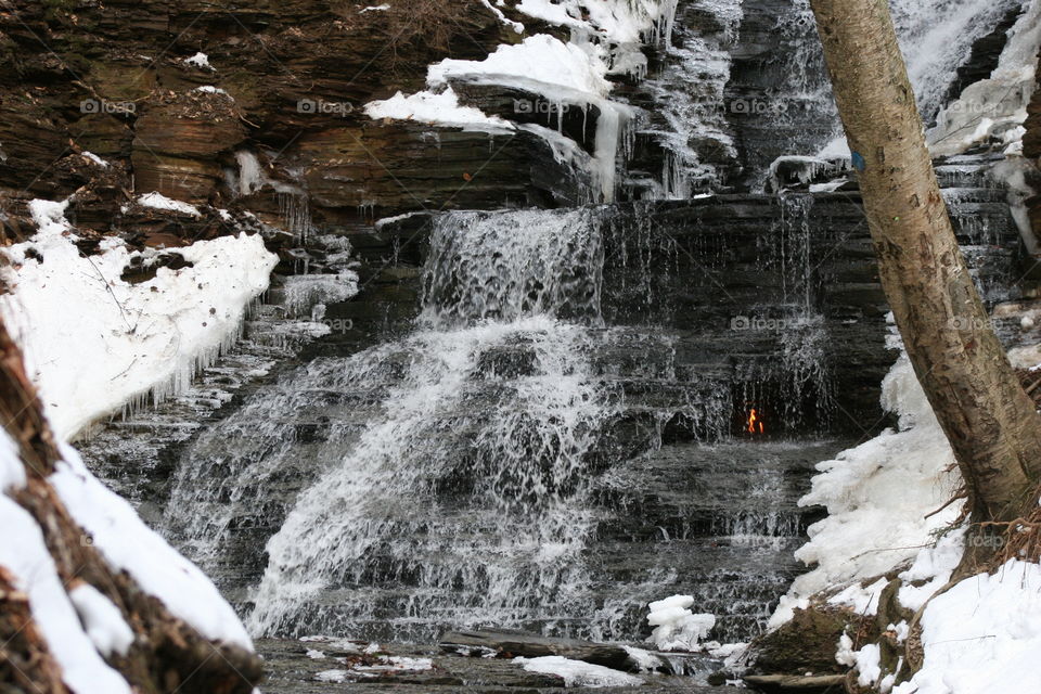 Waterfall during snowfall