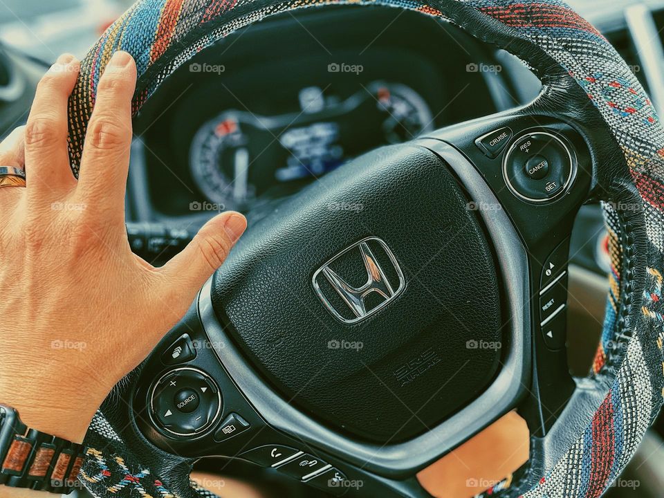 Woman driving, woman’s hand on the steering wheel, driving a Honda Pilot, drivers perspective, hand on the steering wheel while driving, fun steering whee cover 