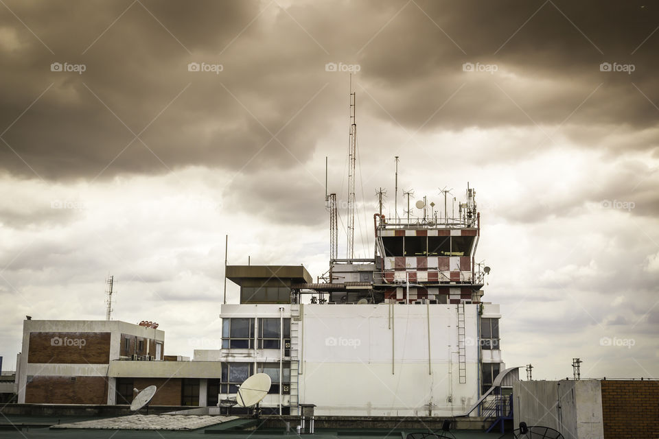 Flight control tower. Building of flight control tower with cloud