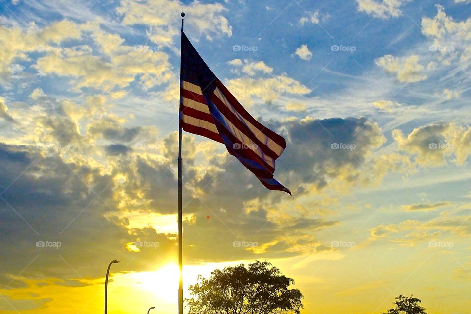 The flag was still there. American flag in the sun set