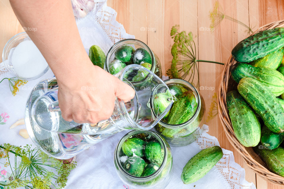 Pickling cucumbers. Pickling cucumbers with home garden vegetables and herbs