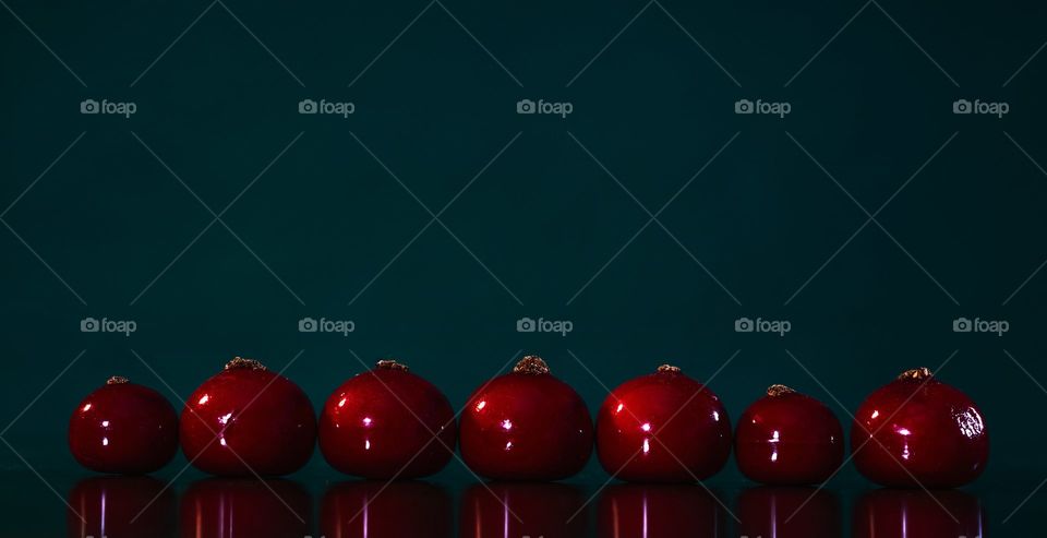 Line Of Rich Red Berries On Blue Background