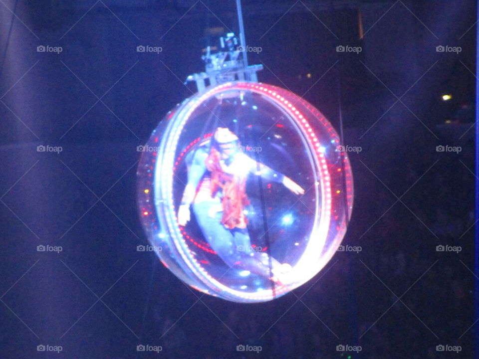 Dancer inside a floating ball in the air.