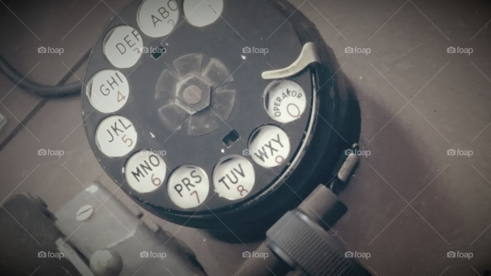 a close up of a rotary used in an old train stations communication system.