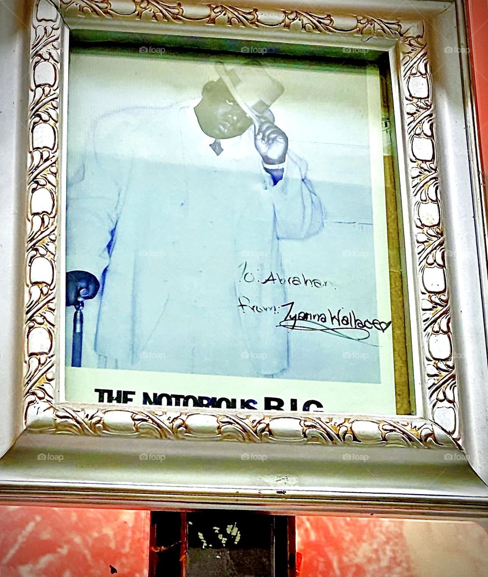 The „Notorious B.I.G.“ „Christopher Wallace“, undisputed king of the neighborhood still today „post mortem“ is wearing the timeless elegance of a traditional white suit & hat paying his respects to all who love him. 2022. Hypnotic Productions