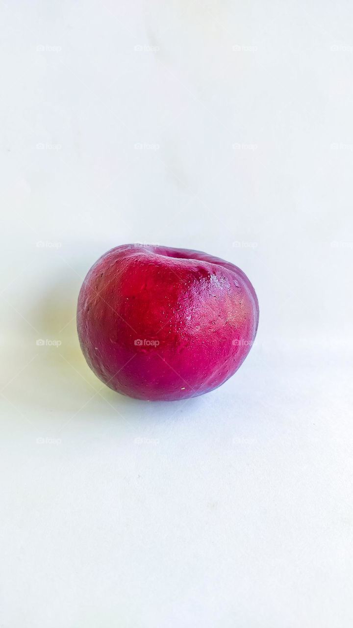 kokum fruit on a white background.