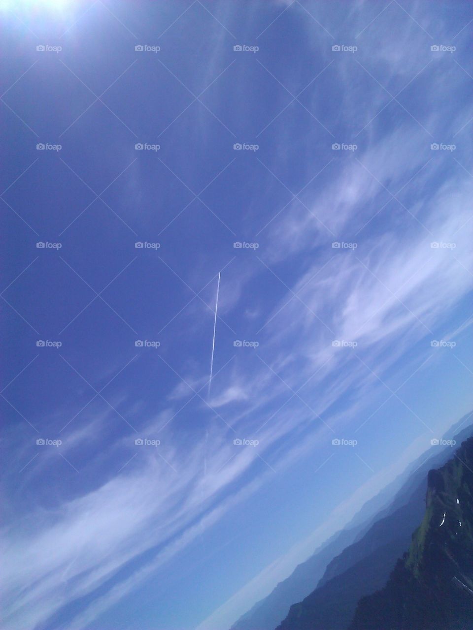 Plane Over Mountains. A picture of a plane with a contrail following taken from Mt. Rainier National Park. 
