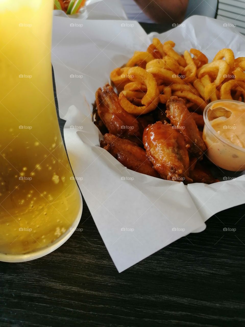 Tasty chicken wings, deep-fried potatoes and cold beer. Life is good and wonderful!