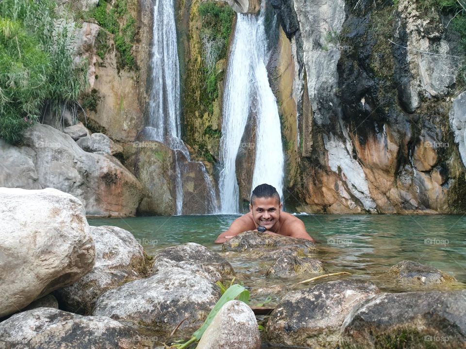 Waterfall#lake#rock#human