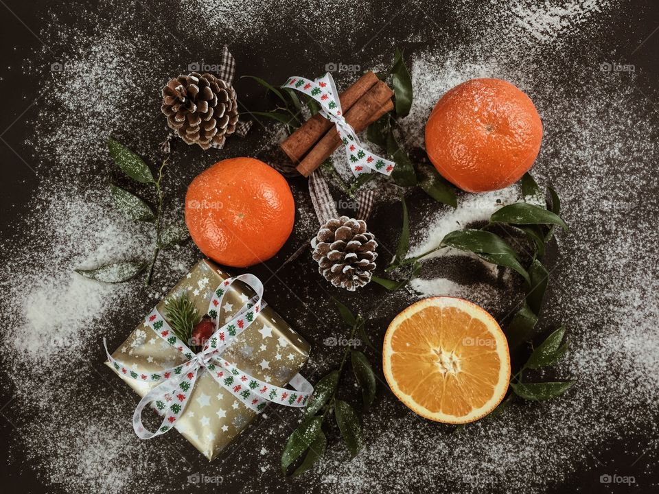 Gift with cinnamon and oranges