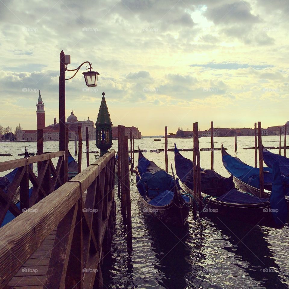 Venetian boats. Lazing the day away by gondolas in the main waters of Venezia
