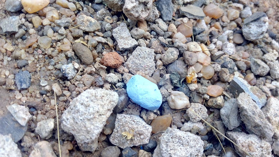 blue chalk and small stones