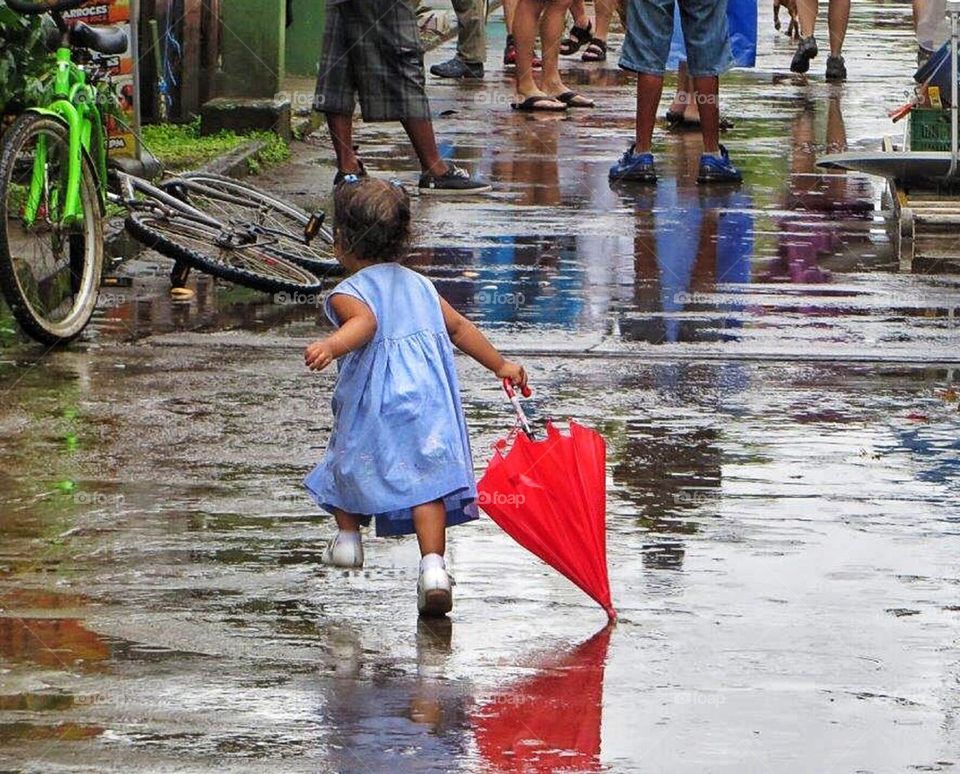 Girl having fun in the rain