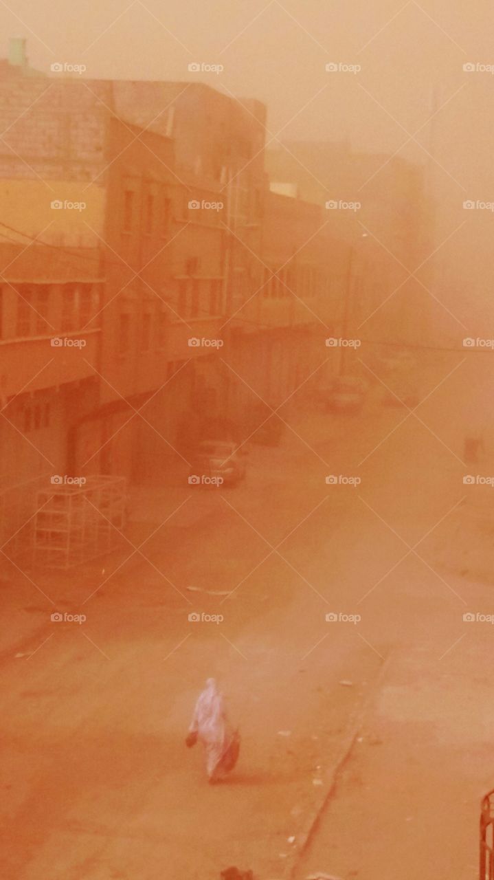 A storm of dust in a city in Sahara