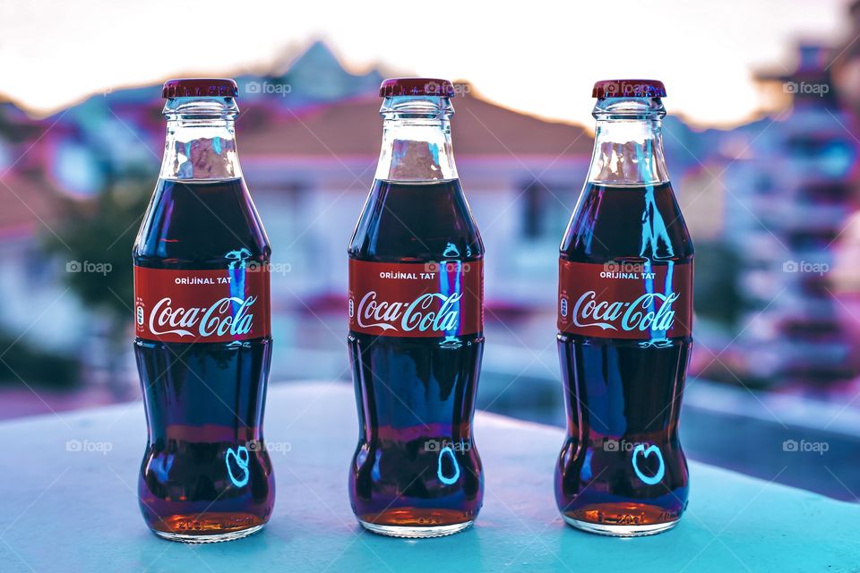 Three bottles of Coca Cola 
