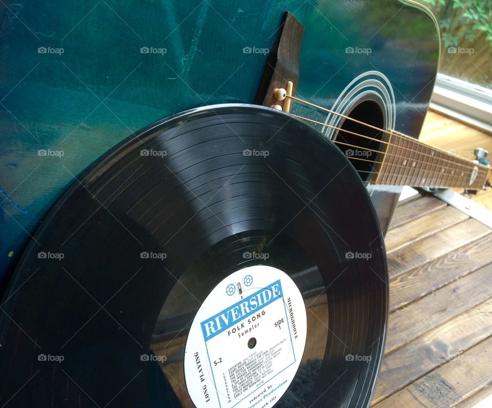 Another perspective of record with blue guitar