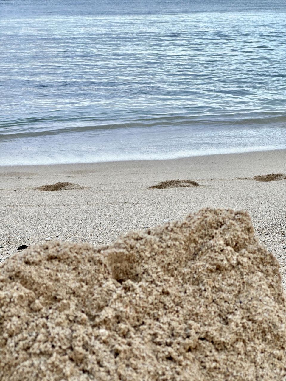 Walking along the beach in the morning, I see the tide coming back in, footsteps where a runner has come by and the ruins of yesterday’s sandcastle - you can feel time and the tide moving slowly 