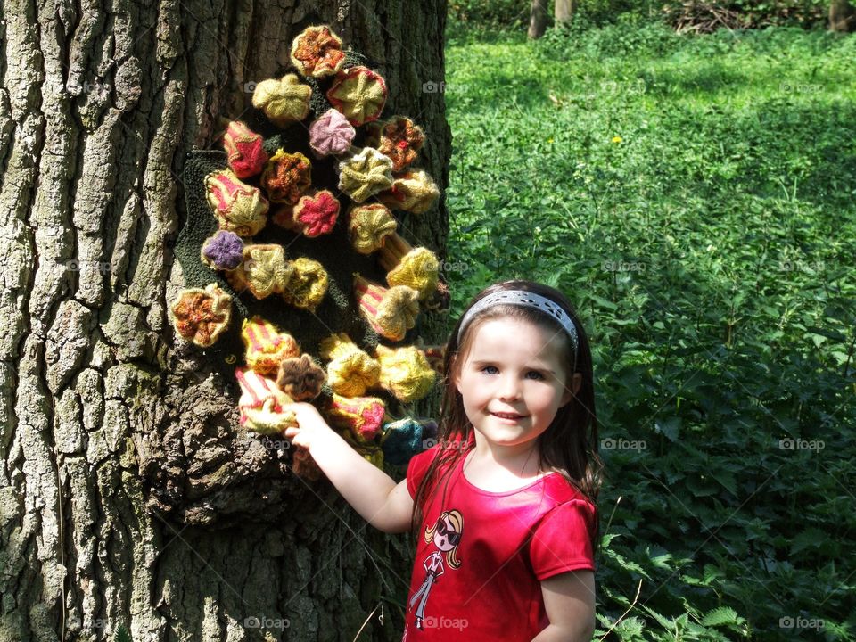 Knitted mushrooms on a tree.