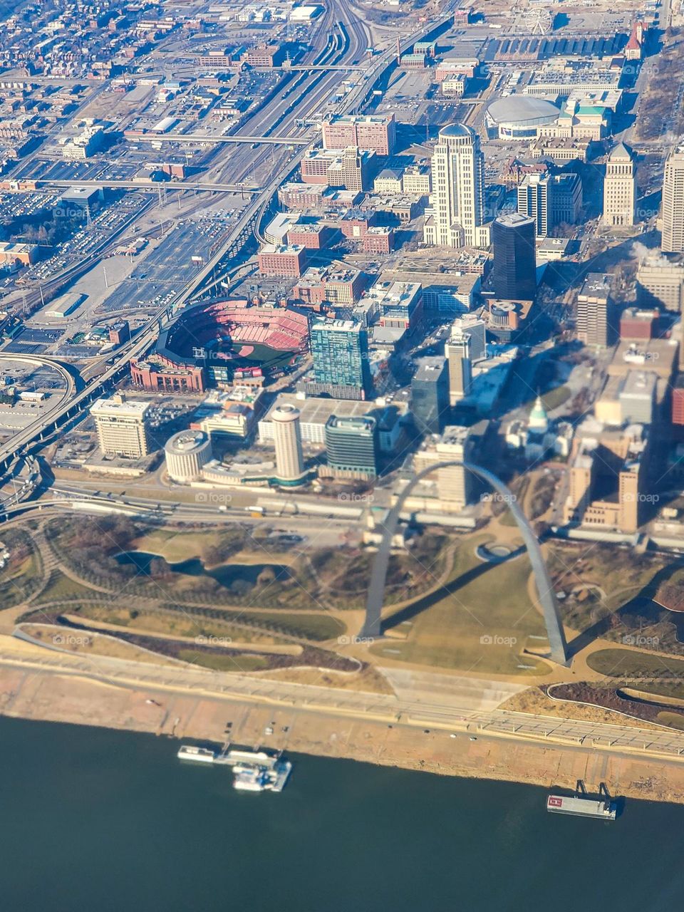 Downtown St Louis Missouri is highlighted by the state capital building, the St Louis Cardinals baseball stadium and the iconic symbol of westward expansion, the Gateway Arch