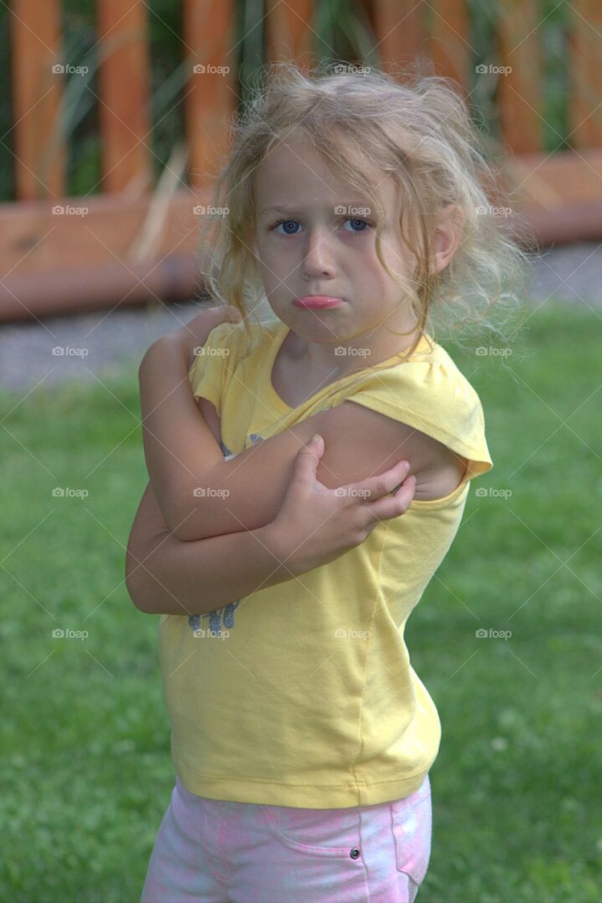 Cute little girl making face