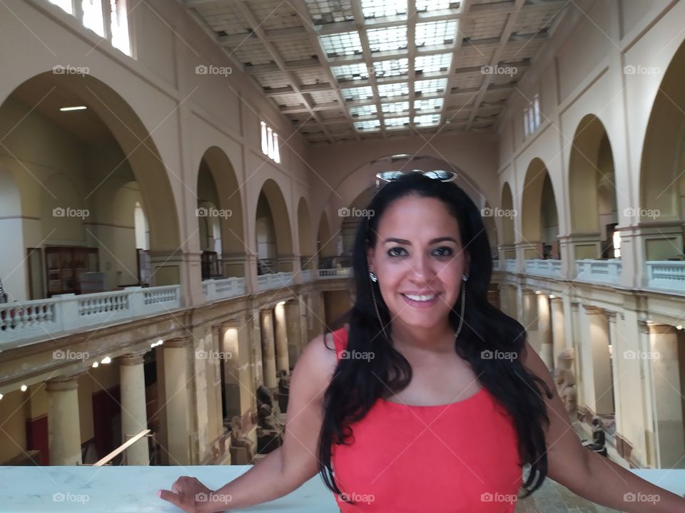 lovely photo with lovely face and beautiful smile from inside the Egyptian museum.