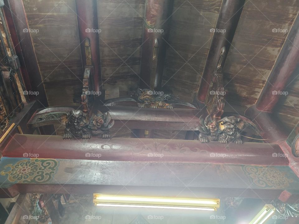 Statues on beams in temples in Taiwan