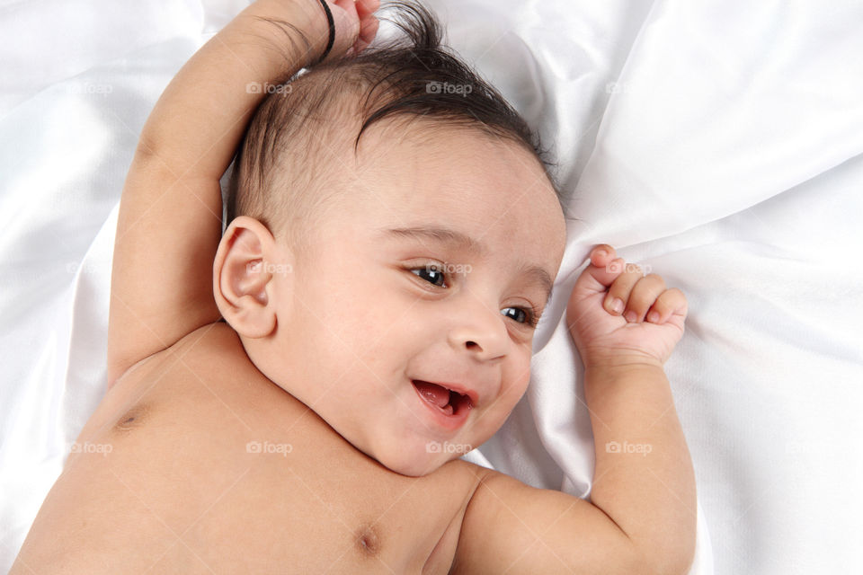 High angle view of smiling baby