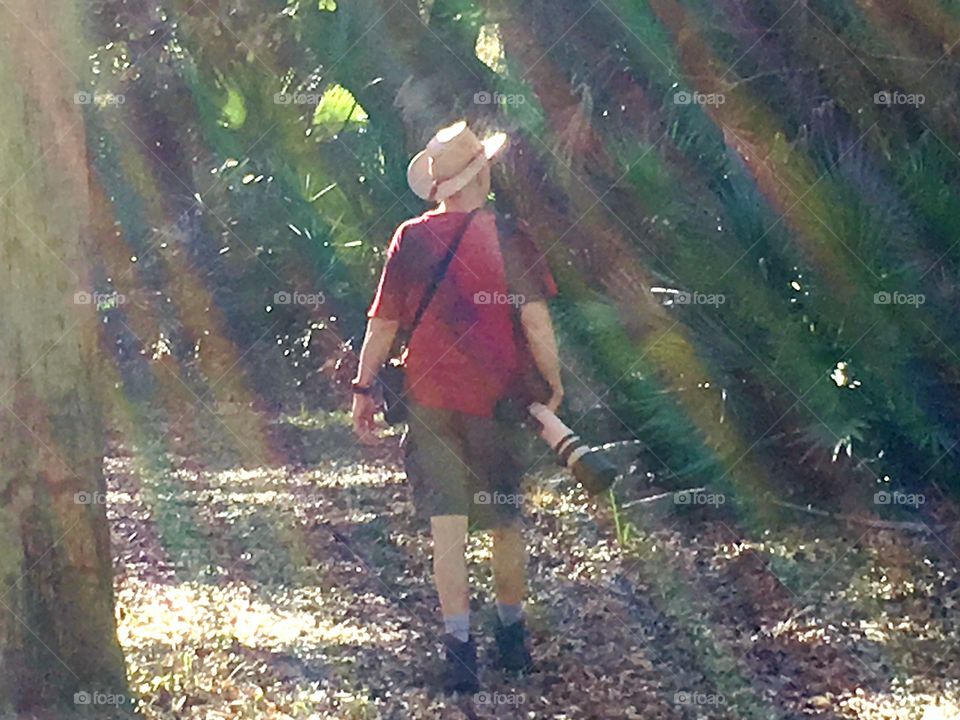 Photographer in sunrays 