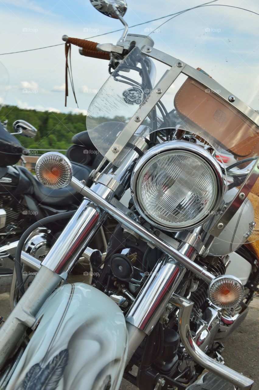 white bike  for traveling together with chrome details and light leather trim. Every road traveler's dream.