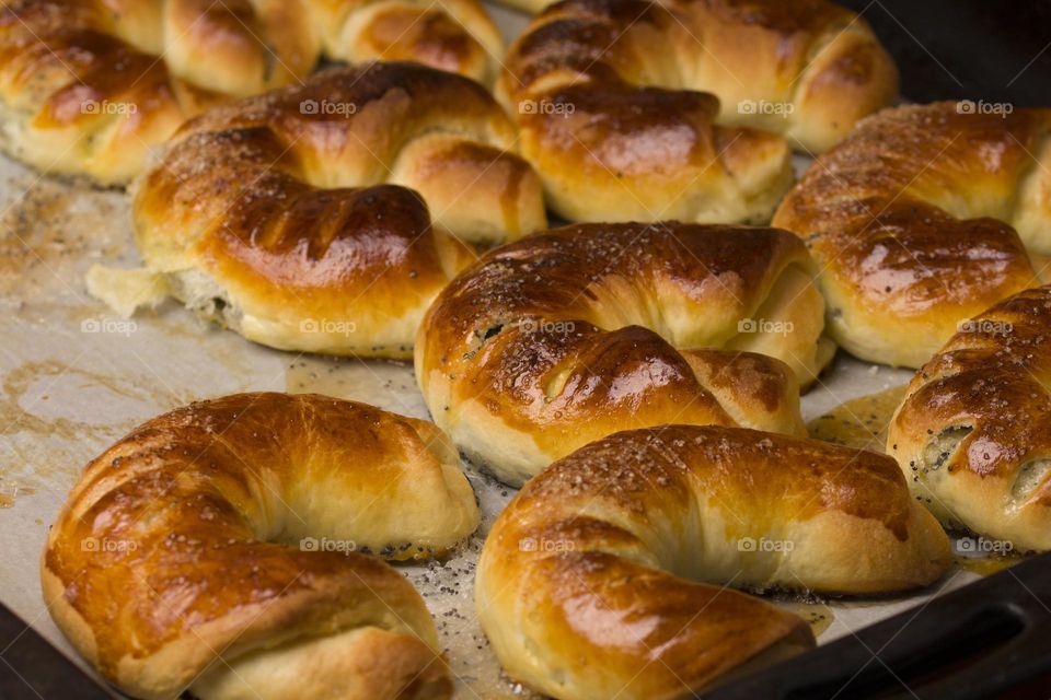 homemade bagels on a black baking sheet from the oven. Ready to eat. Home kitchen concept .