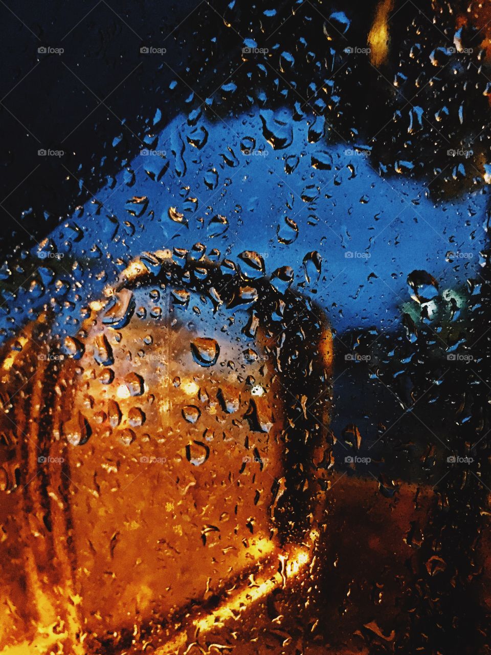 Raindrops on the windows of my car