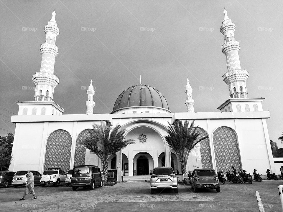 Incredible view from the front of the mosque in Teluk Jambe, Karawang, in black and white effect, with a dark sky in the background
