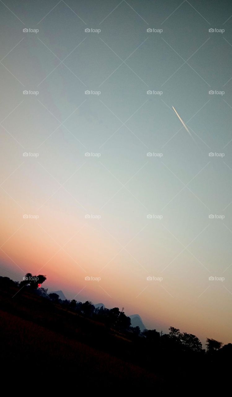 Plane soaring through a kaleidoscope of colors 🌅✈️ Clear sky sunset vibes ✨ Freedom in the skies 🕊️