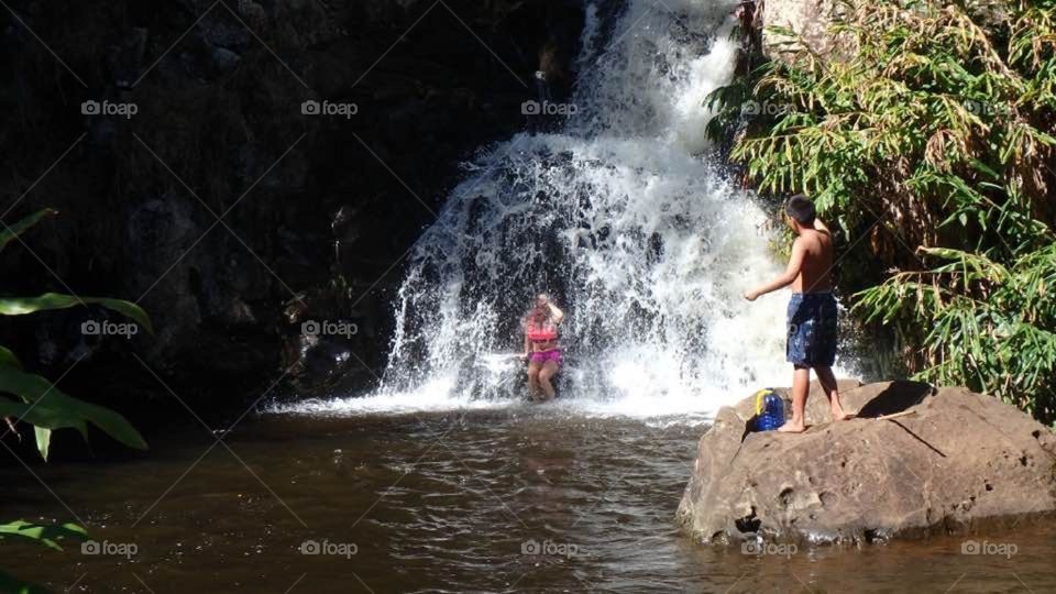 Got dared to go under the Kauai waterfall by a native boy!